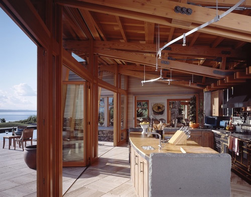 Indoor Outdoor living replaces the separate outdoor kitchen-image via Georgiana design