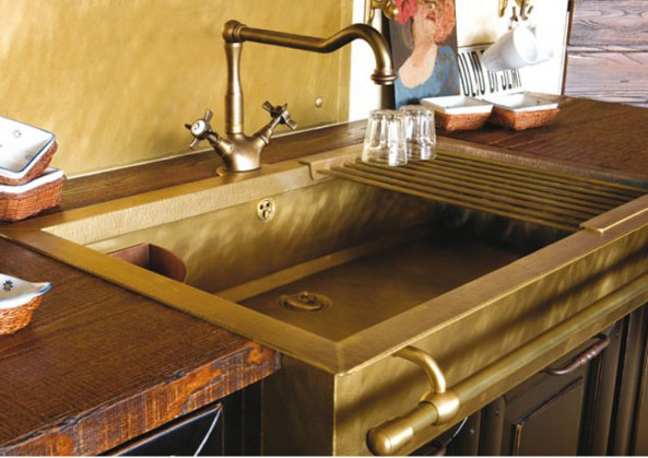 fabulous brass sink, towel rack and plumbing fixtures-image via the Right Bank